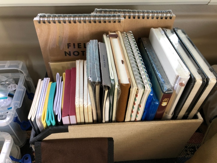 Tote box of notebooks
